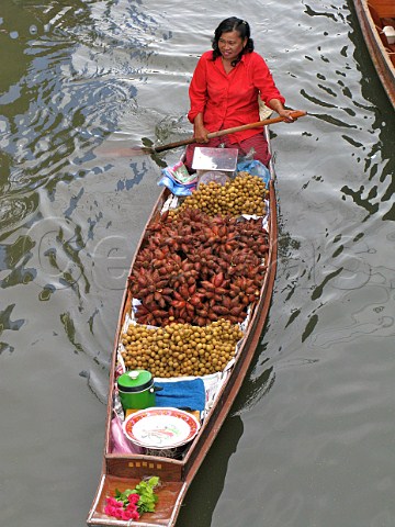 Woman with boatload of vegetables at the floating market Damnoen Saduak Ratchaburi Thailand