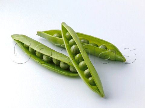 Peas in pods on a  white background
