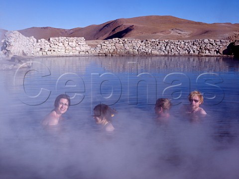 Tourists in the thermal springs at the Tatio Geysers in the Atacama Desert Chile