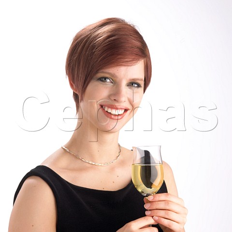 Young woman drinking glass of Riesling wine