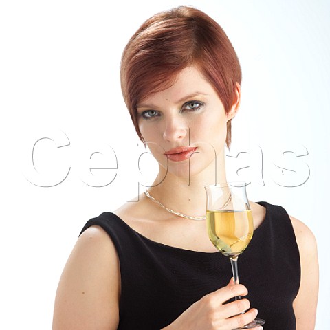 Young woman drinking glass of Riesling wine