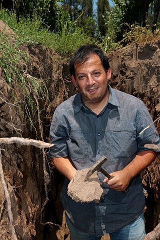 Pedro Parra in a soil profiling pit in vineyard of William Fvre Maipo Chile