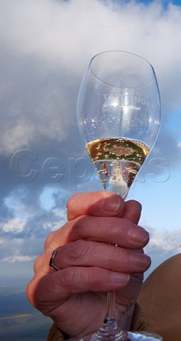 Glass of Champagne in the Taittinger hotair balloon during their altitudinal tasting to research the affect of altitude on the taste and bubbles