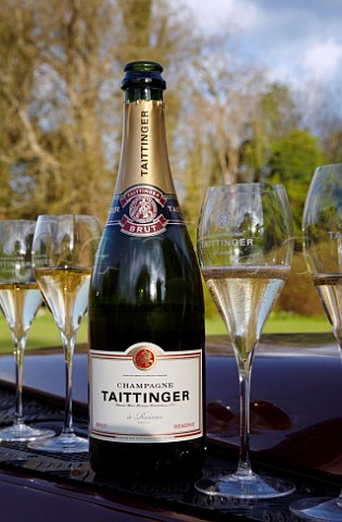 Glasses of Champagne on the bonnet of a Land Rover to drink prior to launching of the Taittinger hotair balloon
