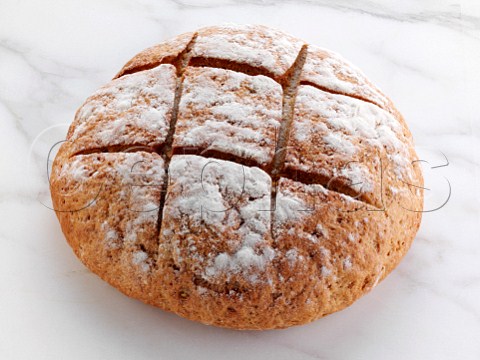 A sourdough loaf on a white background