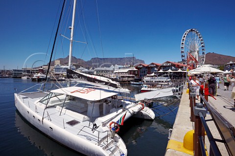 Boats in the harbour of VA Waterfront with the Wheel of Excellence and Table Mountain beyond  Cape Town Western Cape South Africa