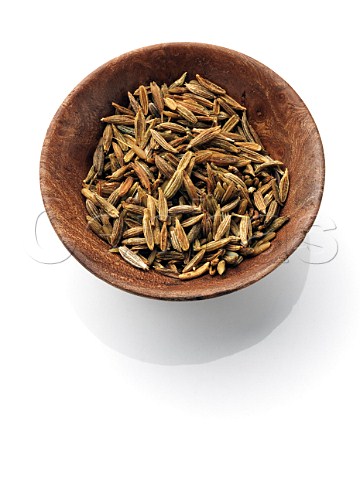 Cumin seeds in a wooden bowl