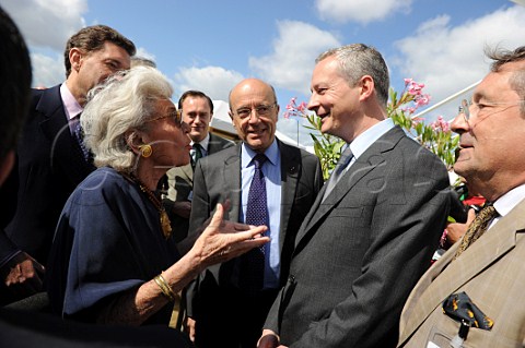 Baroness Philippine de Rothschild died 2014 of Chteau MoutonRothschild talking to Bruno Le Maire Minister of Food Agriculture and Fisheries with Alain Jupp Minister of Foreign Affairs and Mayor of Bordeaux looking on   Vinexpo 2011  Bordeaux France