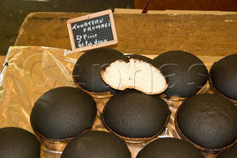 Tourteau Fromage for sale on a market stall Amboise IndreetLoire France