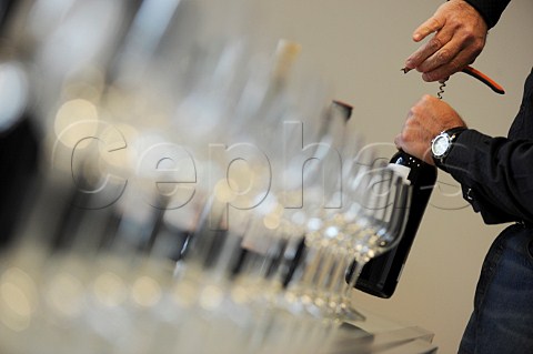 Opening a bottle at a Bordeaux wine tasting