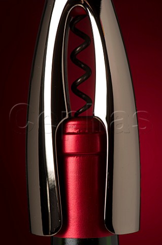 Corkscrew and bottle of wine