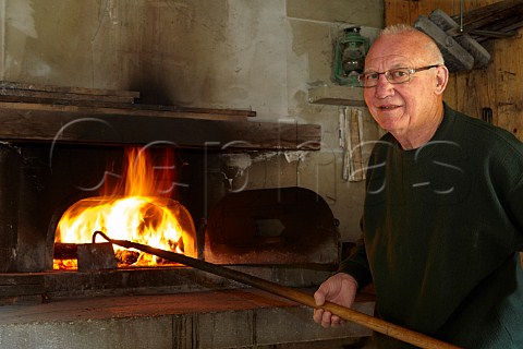 Pierre Overnoy at the bread oven in his restored barn Chaux deau He is often referred to as the father of natural wine Domaine Pierre Overnoy Pupillin Jura  France  ArboisPupillin