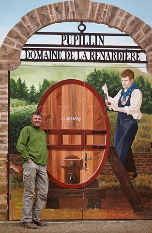 JeanMichel Petit with his mural on wall of Domaine de la Renardire Pupillin near Arbois Jura France  ArboisPupillin