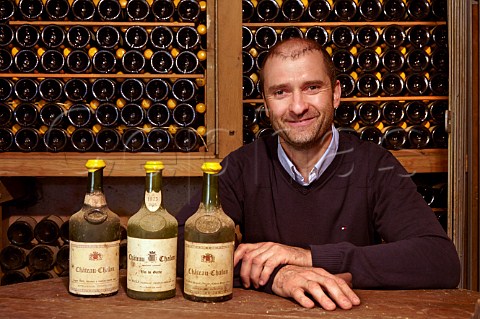 Laurent Macle with vintage bottles of ChteauChalon Domaine Macle ChteauChalon Jura France