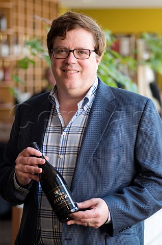 Adam Lee winemaker of Siduri with bottle of his Hirsch Vineyard Pinot Noir  Santa Rosa Sonoma County California