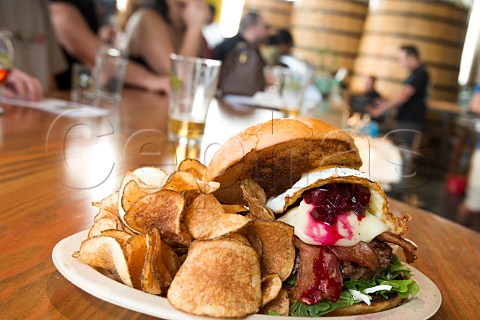 Angus Beefburger with beetroot chutney and fried egg on table at Epic Brewery Denver Colorado USA