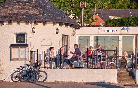 People on the terrace of the Pierhouse Hotel and Restaurant at Port Appin  Highland Argyllshire Scotland