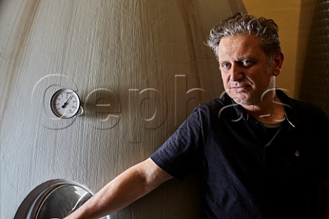 Enzo Boglietti winemaker with concrete egg La Morra Piemonte Italy Barolo