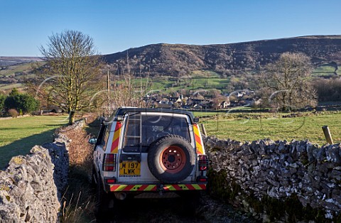 Land Rover on a narrow Green Lane above village of Bradwell Peak District National Park Derbyshire England