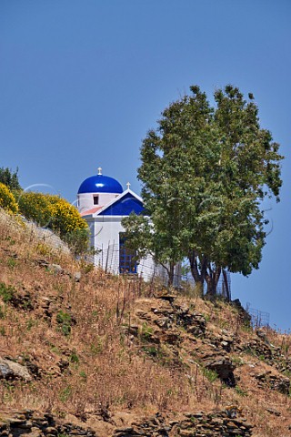 Hillside chapel above village of Aetofolia Tinos Greece