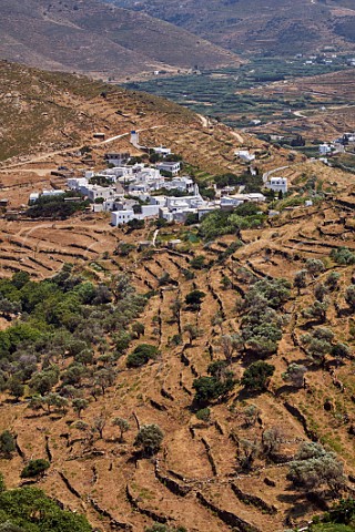 Village of Aetofolia surrounded by old stone terraces Tinos Greece