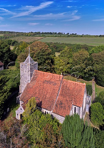 St Peter and St Paul Church at Luddesdown with vineyards of Silverhand Estate in distance Gravesham Kent England