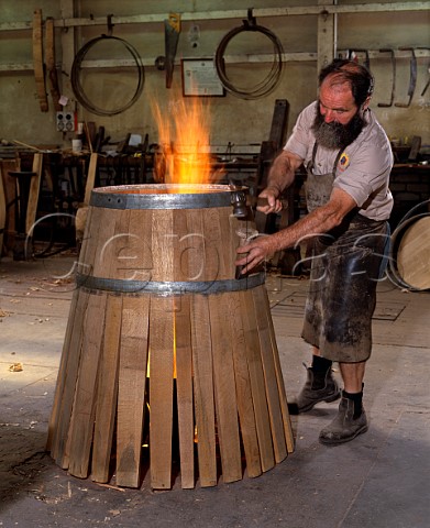 Cooper assembling a barrel using fire to help bend   the staves  Penfolds  Nuriootpa South Australia  Barossa Valley