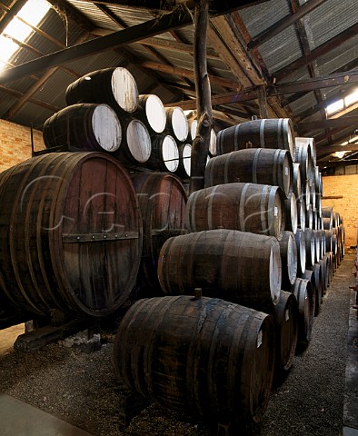Barrels of Liqueur Muscat and Tokay in cellar of Campbells Wines Rutherglen Victoria Australia