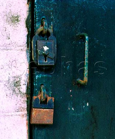 Midleton Whiskey Distillery Two padlocks on the   door of a bonded warehouse  the top one has the   paper seal of the Customs and Excise Midleton   County Cork Eire