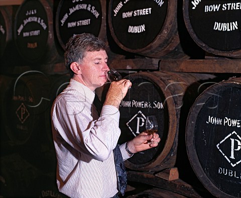 Barry Crockett Head Distiller checks on the   progress of his whiskey maturing in barrel Midleton   Distillery County Cork Eire