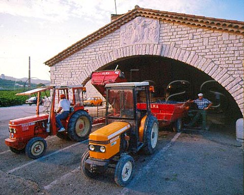 Tractors unloading harvested grapes at the   cooperative in Tavel Gard France    Tavel