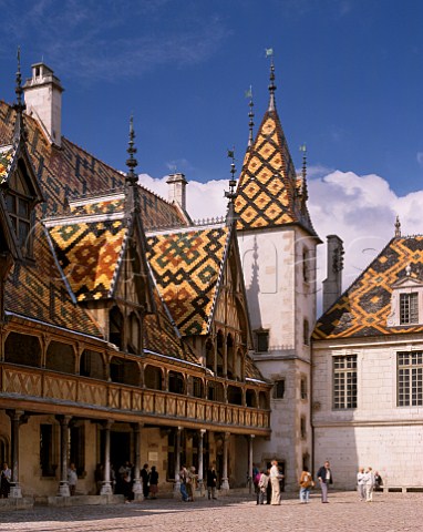 In the courtyard of the Hospices de Beaune   with its polychrome tiled roof  Beaune Cte dOr France