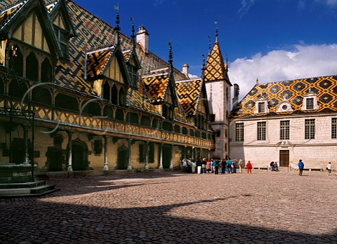 Tourists in the courtyard of the Hospices de Beaune Beaune Cte dOr France