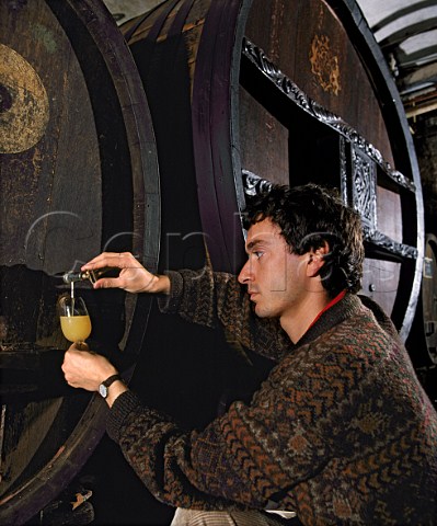Etienne Hugel taking sample of fermenting wine from cask The StCatherine Cask 1715 the oldest cask in the world still in continuous use is behind him   Hugel et Fils Riquewihr HautRhin France     Alsace