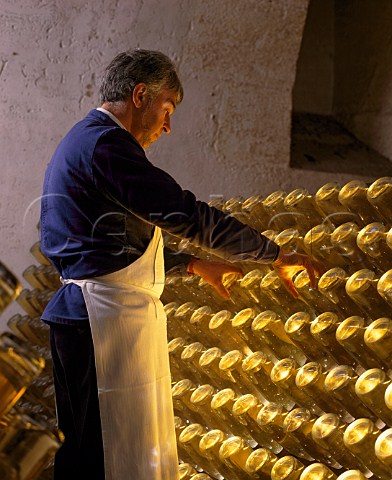 Performing the remuage on bottles of Cristal   champagne in the cellars of Louis Roederer     Reims Marne France