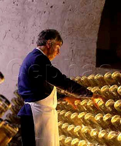 Performing the remuage on bottles of Cristal   champagne in the cellars of Louis Roederer Reims