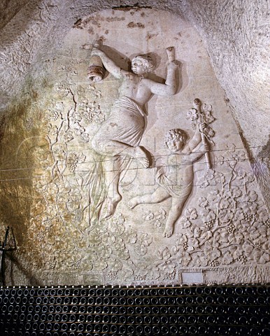 Fresco by Henri Navlet above bottles of Champagne   stored sur lattes in the cellars of Veuve   ClicquotPonsardin The cellars are in the old   GalloRoman chalk quarries of Reims