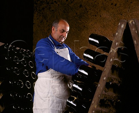 Performing the remuage on Methode Traditionelle   sparkling wine in pupitres in the cellars of Chteau   de Beaulieu owned by Gratien Meyer et Seydoux  Saumur MaineetLoire France