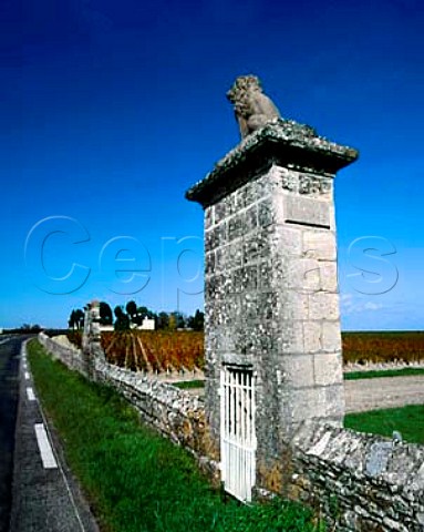 D2 road by vineyard of Chteau Latour with ChteauPichonLonguevilleComtessedeLalande beyond Themonuments in the wall signify the end of Chteau LovillelasCases vineyards in the commune ofStJulien and the start of Latour in Pauillac  Gironde France  Mdoc  Bordeaux