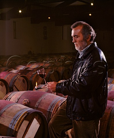 Monsieur Raoul the Matre de Chais using a candle   to check the clarity of the wine from barrique   Chteaux Langoa and LovilleBarton    StJulien Gironde France  Mdoc  Bordeaux