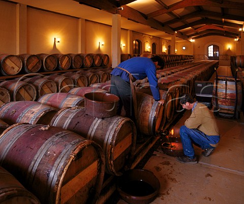 2ndyear wines undergoing soutirage racking in chai of Chteau Palmer Cantenac Gironde France  Margaux  Bordeaux