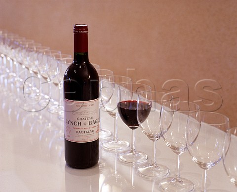 Bottle and glass of Chteau LynchBages in the  tasting room at the chteau Pauillac Gironde  France  Mdoc  Bordeaux