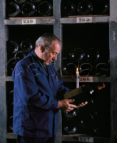 Examining a Jeroboam of 1971 in the vintage bottle cellar of Chteau Latour   Pauillac Gironde France  Mdoc  Bordeaux