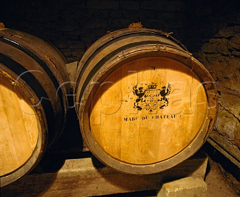 Marc maturing in barrel in cellar of Chateau de   Meursault Burgundy Marc is a spirit distilled from   grape skins