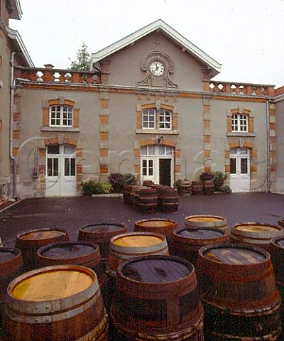 Barrels in the courtyard of Champagne Krug Reims   France   Champagne