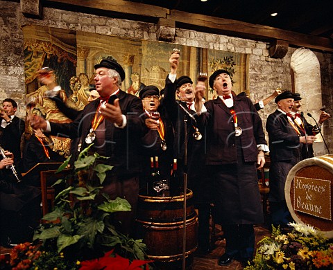 The singers at the dinner held by the Confrerie des Chevaliers du Tastevin in the Chteau du Clos de Vougeot This is one of the three grand meals known as Les Trois Glorieuses which are held around the Hospices de Beaune wine auction which takes place on the third Sunday in November Vougeot Cte dOr France