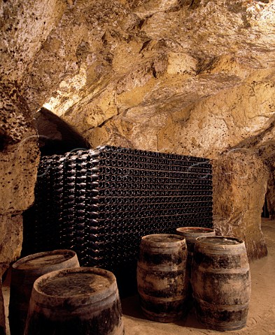 Wine maturing in cave of Chteau de la Grille which   has been cut out of the soft tuffeau subsoil Chinon IndreetLoire France