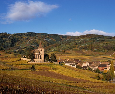 Hunawihr and its 15thcentury fortified church with  the Grand Cru Rosacker vineyard on the slope beyond the village  HautRhin France  Alsace