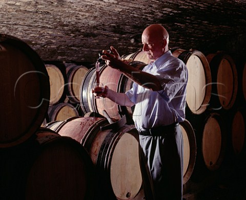 Hubert de Montille died 2014 taking a sample of premier cru   Taille Pieds from barrel in his cellars  Volnay Cte dOr France   Cte de Beaune
