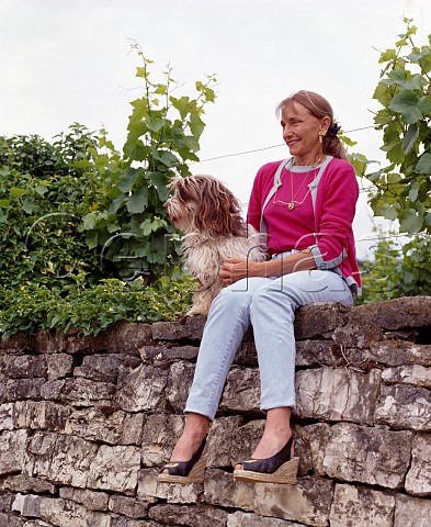 Lalou BizeLeroy and Basil on the wall at the top of her parcel of the Grand Cru Richebourg vineyard VosneRomane Cte dOr France Cte de Nuits
